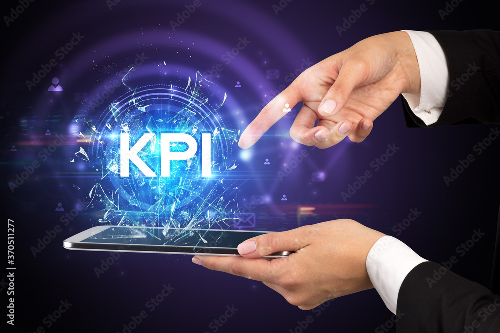 Close-up of a touchscreen with KPI abbreviation, modern technology concept Close-up of a touchscreen with KPI abbreviation, modern technology concept