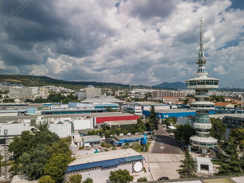 Thessaloniki, Greece aerial drone view of empty International trade TIF fair. Day view panorama of HELEXPO premises without crowd and OTE Telecommunications Tower visible. photo