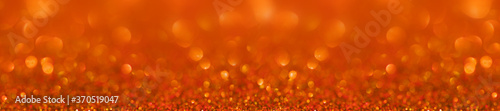 Panorama orange glitter bokeh background