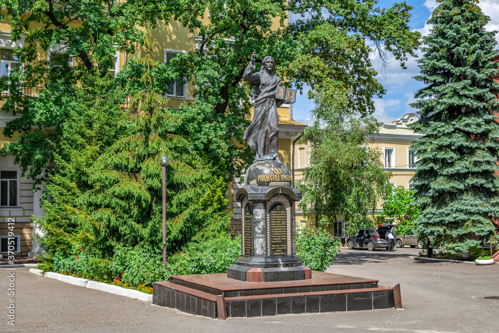 Kharkiv, Ukraine - July 20, 2020: Memorial sign of the 2000th anniversary of the Nativity of Christ in the Pokrovsky Monastery in Kharkiv. Monument to Jesus Christ in front of the episcopal residence