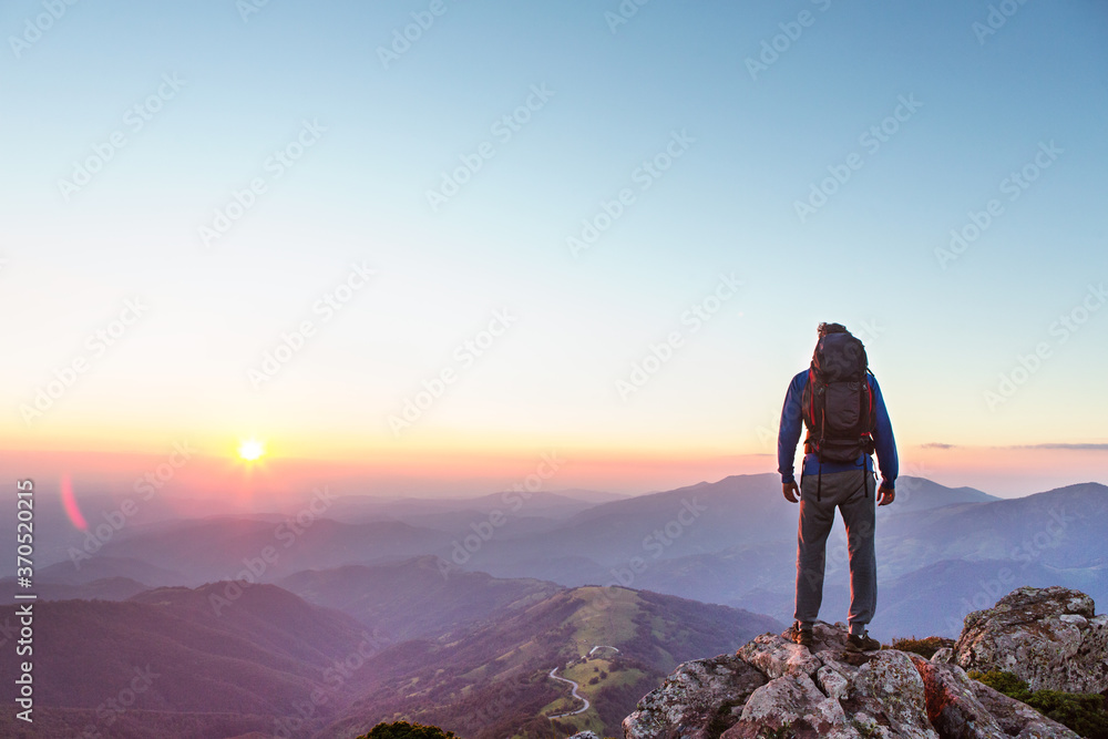 Fototapeta premium Hiker on the top of the mountain, landscape view