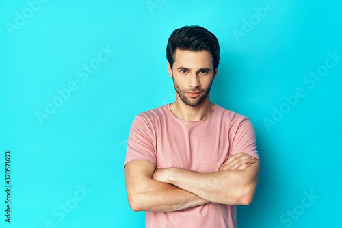 Young handsome man portrait sitting on floor in sun lights with copy space