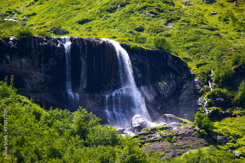 Amazing and beautiful waterfall in the mountains. Okhrotskhali waterfall in Svaneti