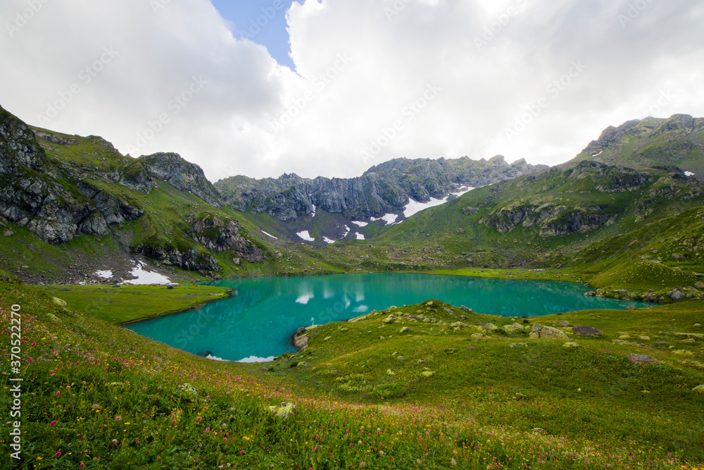 Alpine mountain lake landscape and view, blue beautiful and amazing lake panorama Alpine mountain lake landscape and view, blue beautiful and amazing lake panorama