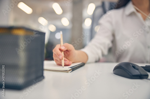 Close up of conscious worker making notes