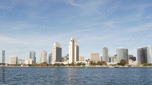 Metropolis urban skyline, highrise skyscrapers of city downtown, San Diego Bay, California USA. Waterfront buildings near pacific ocean harbour. View from boat, nautical public transport to Coronado © Dogora Sun