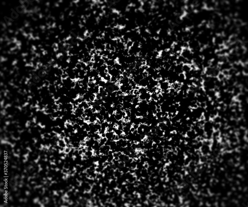 Dirty black dots texture with circular blur. © forwforw