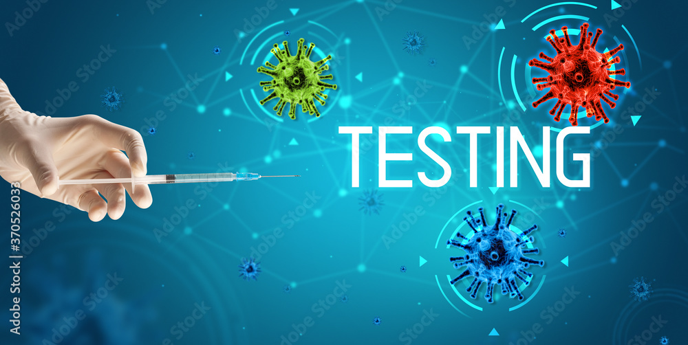 Syringe, medical injection in hand with TESTING inscription, coronavirus vaccine concept Syringe, medical injection in hand with TESTING inscription, coronavirus vaccine concept