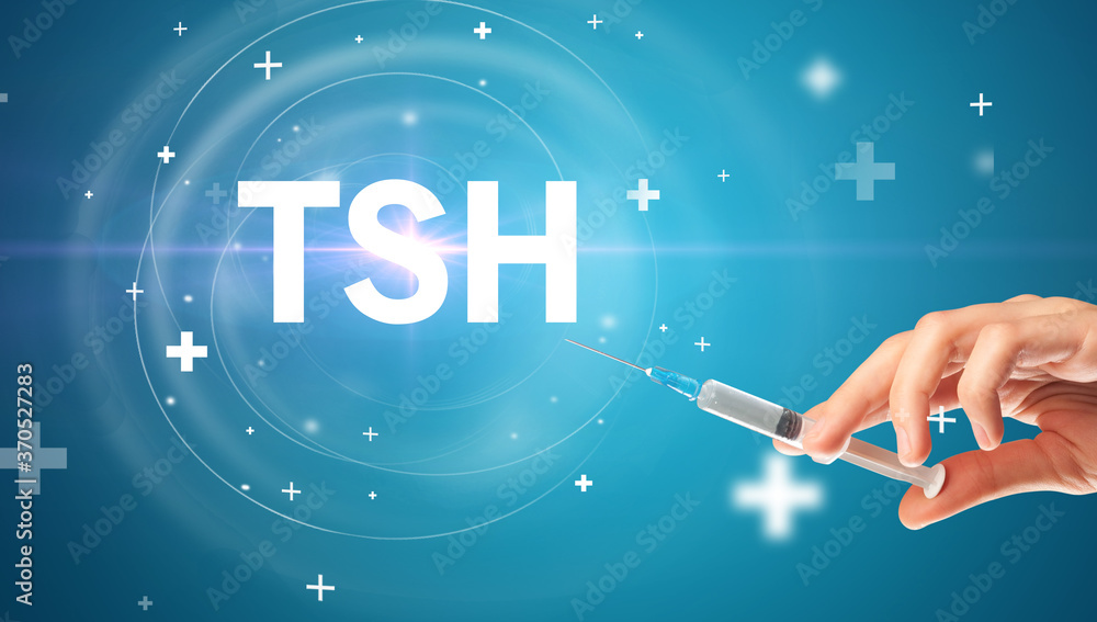 Syringe needle with virus vaccine and TSH abbreviation, antidote concept Syringe needle with virus vaccine and TSH abbreviation, antidote concept