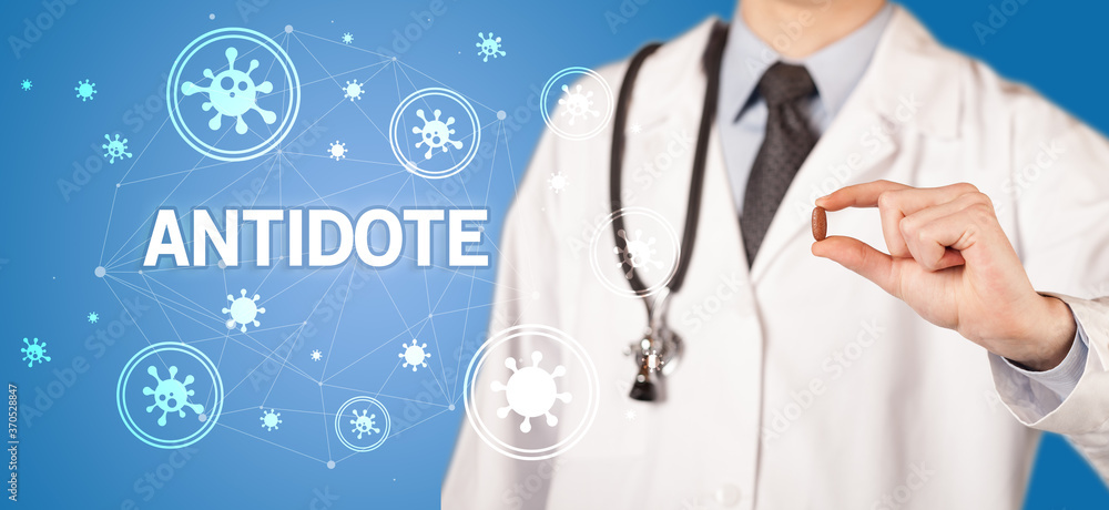 Doctor giving pill with ANTIDOTE inscription, coronavirus concept Doctor giving pill with ANTIDOTE inscription, coronavirus concept