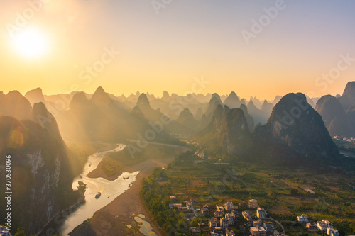 Sunlight over the beautiful karst landscape of Xingping, Guilin, China photo