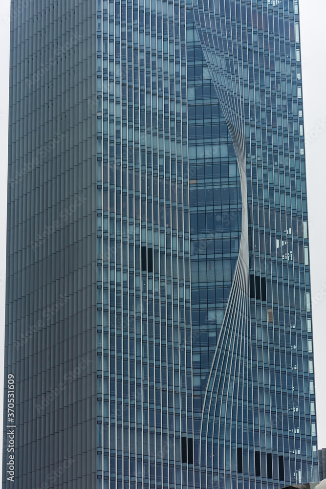 Fototapeta premium SHENZHEN, CHINA, 02 JANUARY 2020: The twisted skyscraper of Shenzhen business district, symbol of environmental sustainability