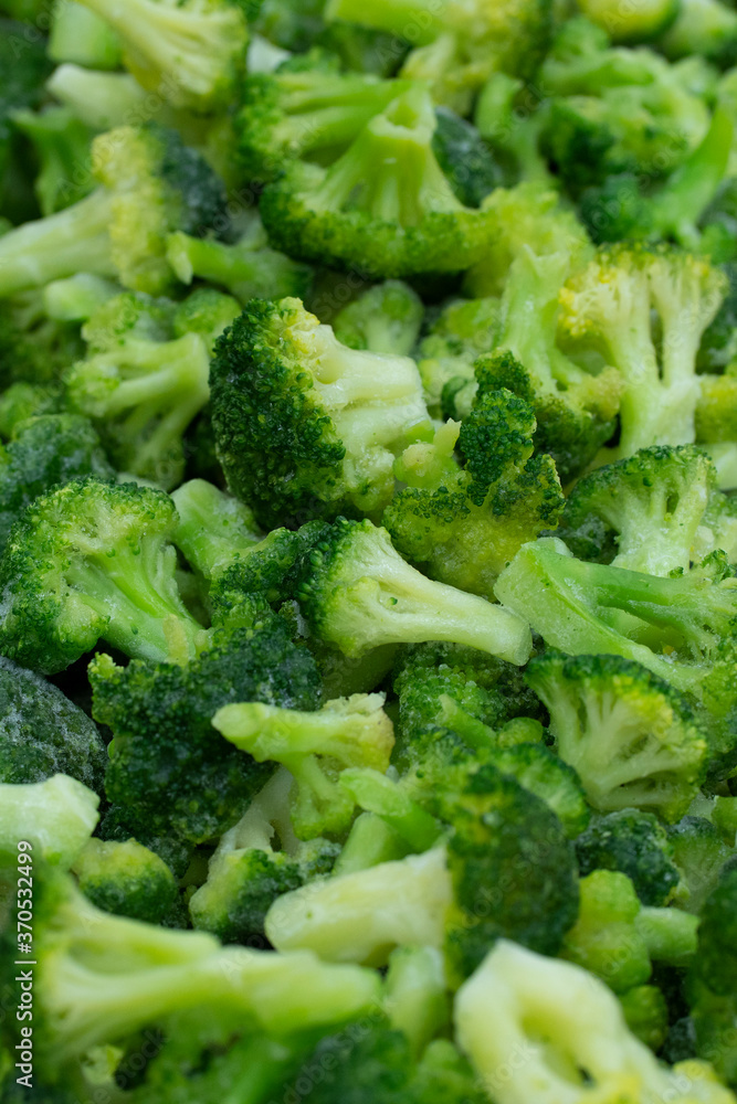 Broccoli frozen close-up, vertical photo