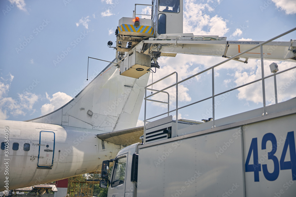 Close up of special machine raising crane upwards Close up of special machine raising crane upwards
