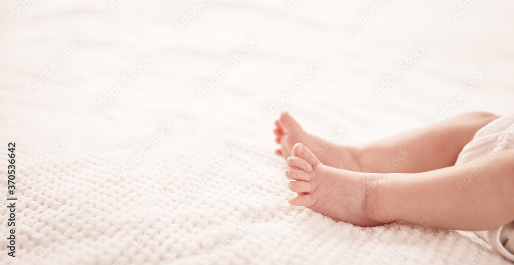 Cute newborn baby girl lying in the bed Cute newborn baby girl lying in the bed