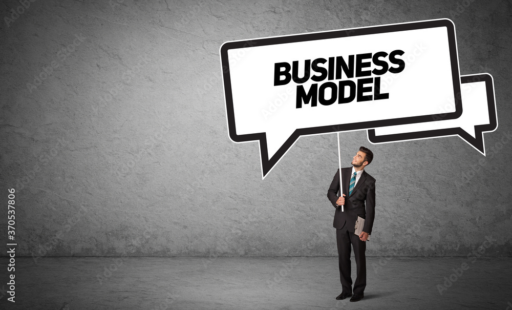 Young business person in casual holding road sign with BUSINESS MODEL inscription, new business idea concept Young business person in casual holding road sign with BUSINESS MODEL inscription, new business idea concept