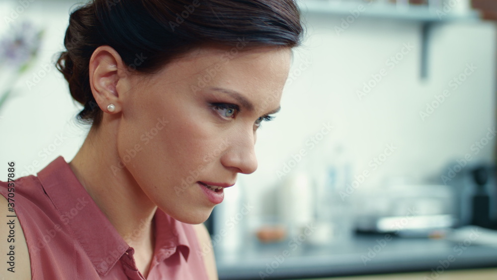 Woman freelancer working in kitchen. Businesswoman typing email on laptop. Woman freelancer working in kitchen. Businesswoman typing email on laptop.