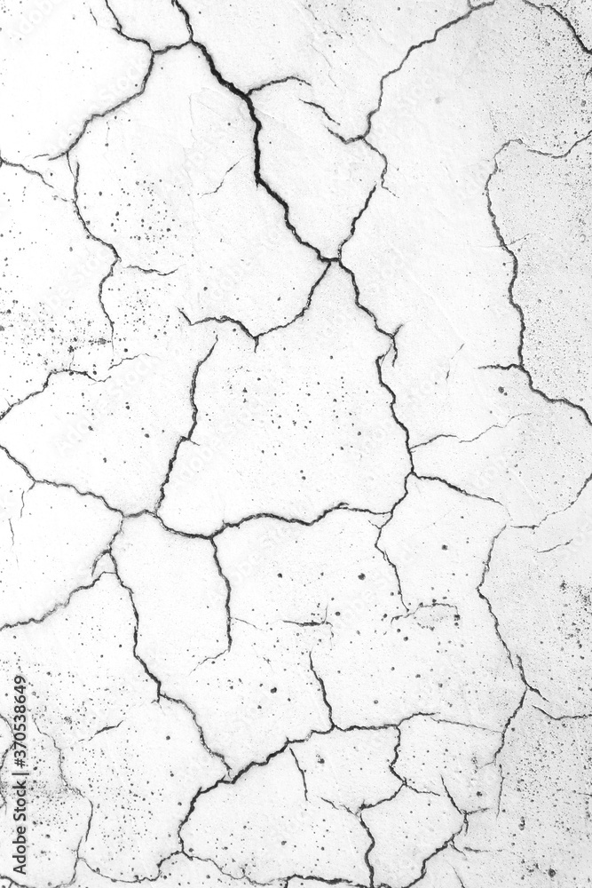 Obraz premium White cracked wall. Abstract background.