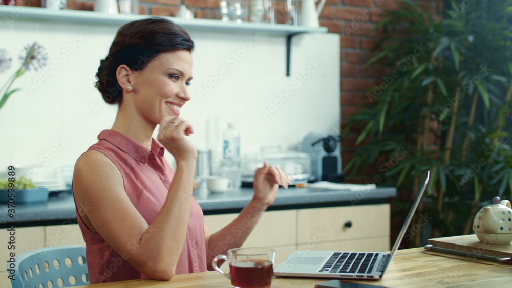 Business woman finishing work on laptop. Young girl drinking tea at home. Business woman finishing work on laptop. Young girl drinking tea at home.