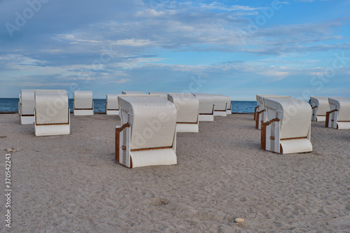 Empty beach cabins on a deserted beach. photo