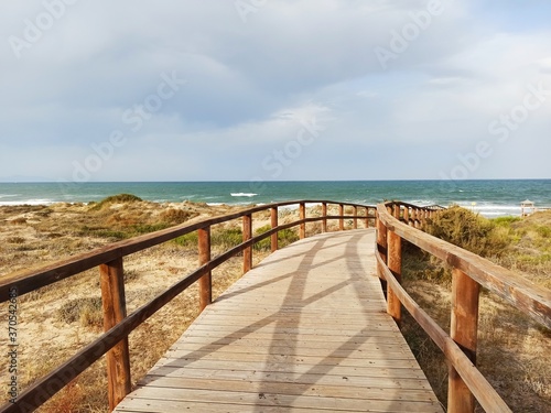 wooden bridge over the sea in Arenales del Sol