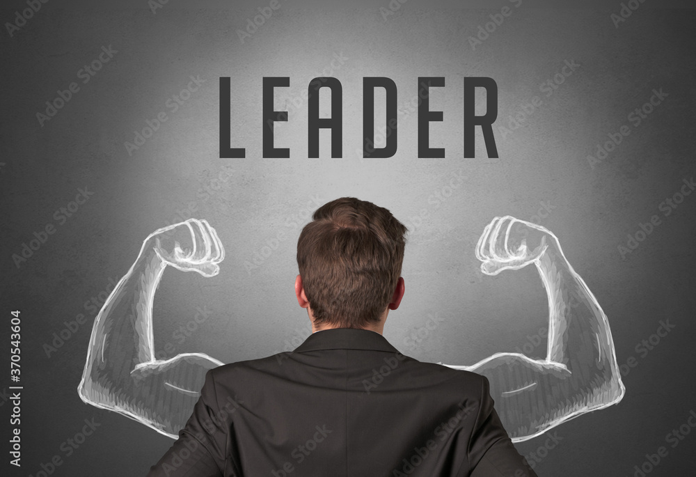 Rear view of a businessman with LEADER inscription, powerfull business concept Rear view of a businessman with LEADER inscription, powerfull business concept
