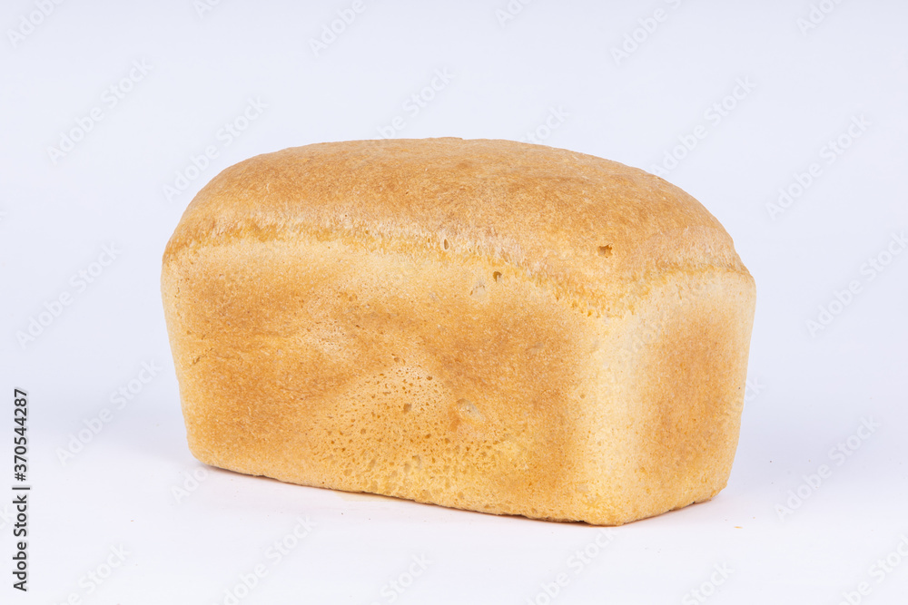 a loaf of fresh wheat bread on a white background a loaf of fresh wheat bread on a white background