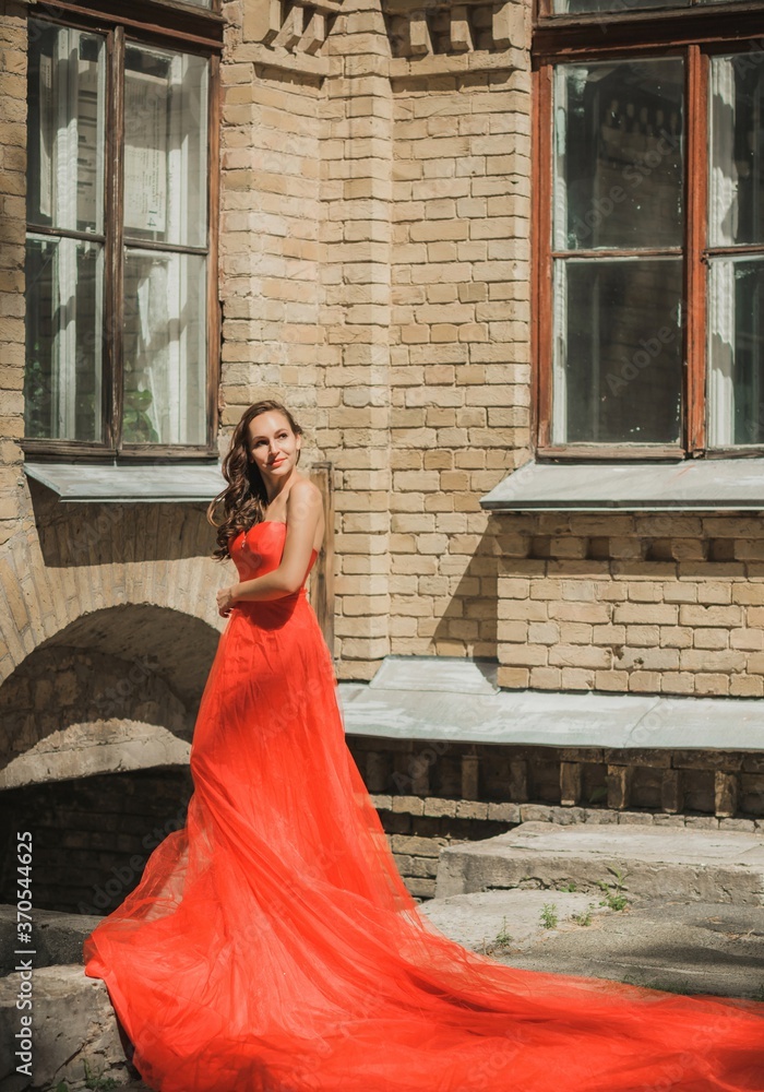 Evening dresses concept, elegant fancy style. Woman in evening red dress. Clothes for ladies, inspiration Evening dresses concept, elegant fancy style. Woman in evening red dress. Clothes for ladies, inspiration