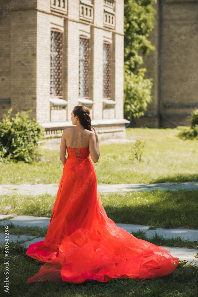 Evening dresses concept, elegant fancy style. Woman in evening red dress. Clothes for ladies, inspiration Evening dresses concept, elegant fancy style. Woman in evening red dress. Clothes for ladies, inspiration