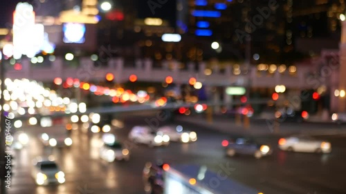 Defocused fabulous Las Vegas Strip boulevard, luxury casino and hotel, gambling area in Nevada, USA. Nightlife and traffic near Fremont street in tourist money playing resort. Neon lights of sin city.