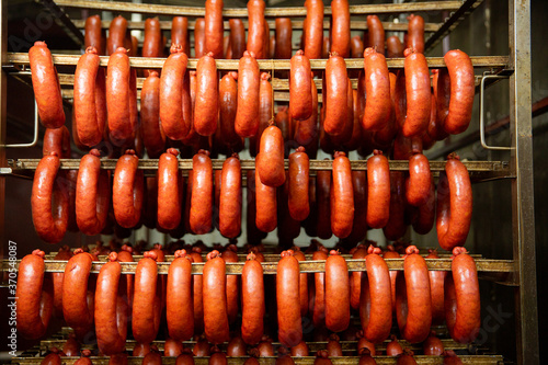Lots of traditional sausage hanging in the warehouse