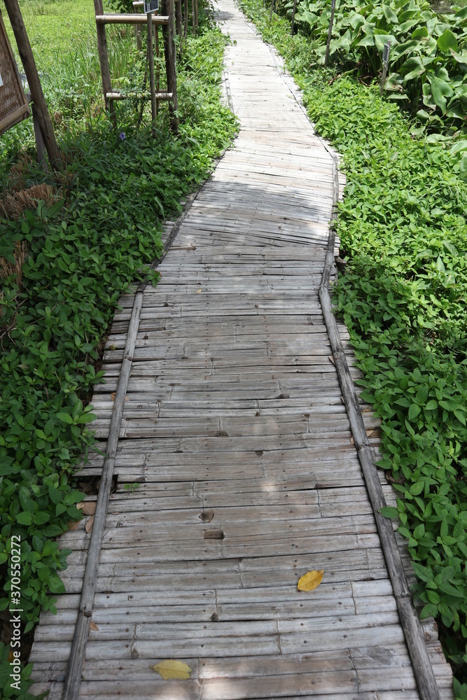 A wooden walkway that passes through the fields along the way