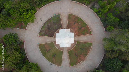 Aerial Top-Down Crane-Up shot of people walking in the Bharathi Park near the shores of Pondicherry Rock Beach shot with a drone in 4k. photo