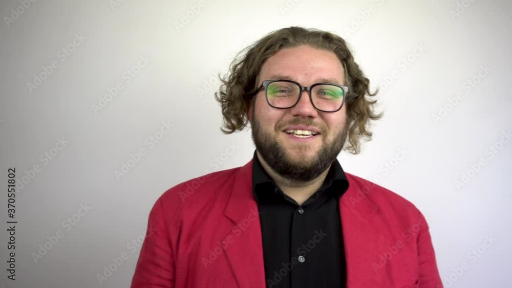 Happy young man communicating via video chat. White background.Red suit.4k Happy young man communicating via video chat. White background.Red suit.4k