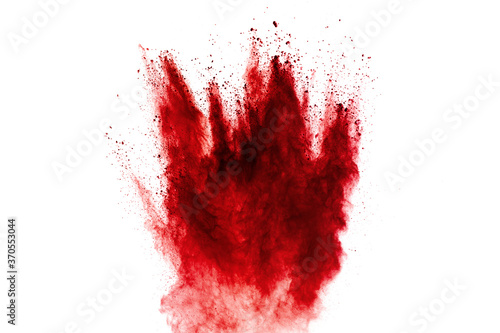 Bilde på lerret Red dust particles explosion on white background.Red sand splash.