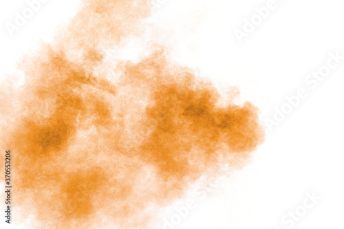 Brown powder dust cloud.Brown particles splattered on white background.