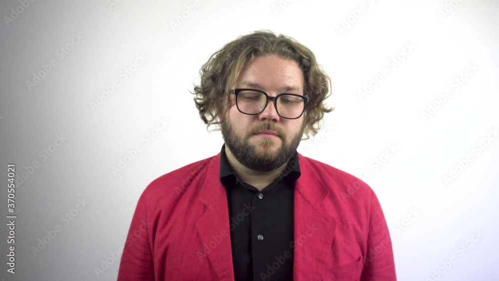 Tired young man in a red jacket. Depressed man. Sighs young man.Stressful work overload for a young businessman. Tired young man in a red jacket. Depressed man. Sighs young man.Stressful work overload for a young businessman.
