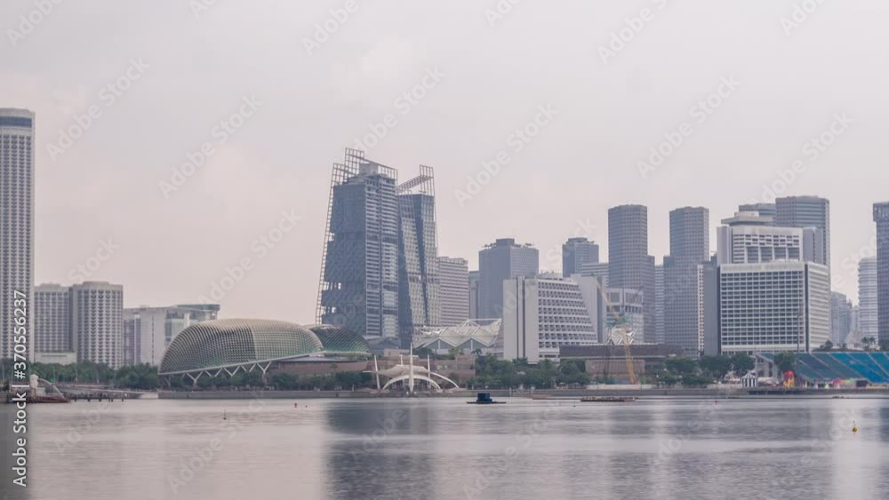 Skyline with skyscrapers of Marina Bay timelapse hyperlapse. With Esplanade world renowned performing arts centre. Its twin domes which looks like a durian Skyline with skyscrapers of Marina Bay timelapse hyperlapse. With Esplanade world renowned performing arts centre. Its twin domes which looks like a durian