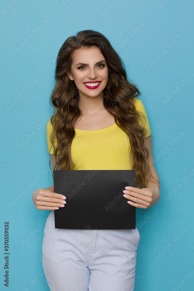 Cute Woman Is Holding Black Empty Sheet Of Paper Cute Woman Is Holding Black Empty Sheet Of Paper