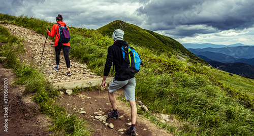 Fototapeta Naklejka Na Ścianę i Meble -  Hiking in the mountain.  Hiker with a backpack.