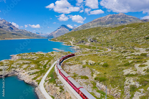 Switzerland, Bernina Pass, aerial view of the train and the Bianco lake photo