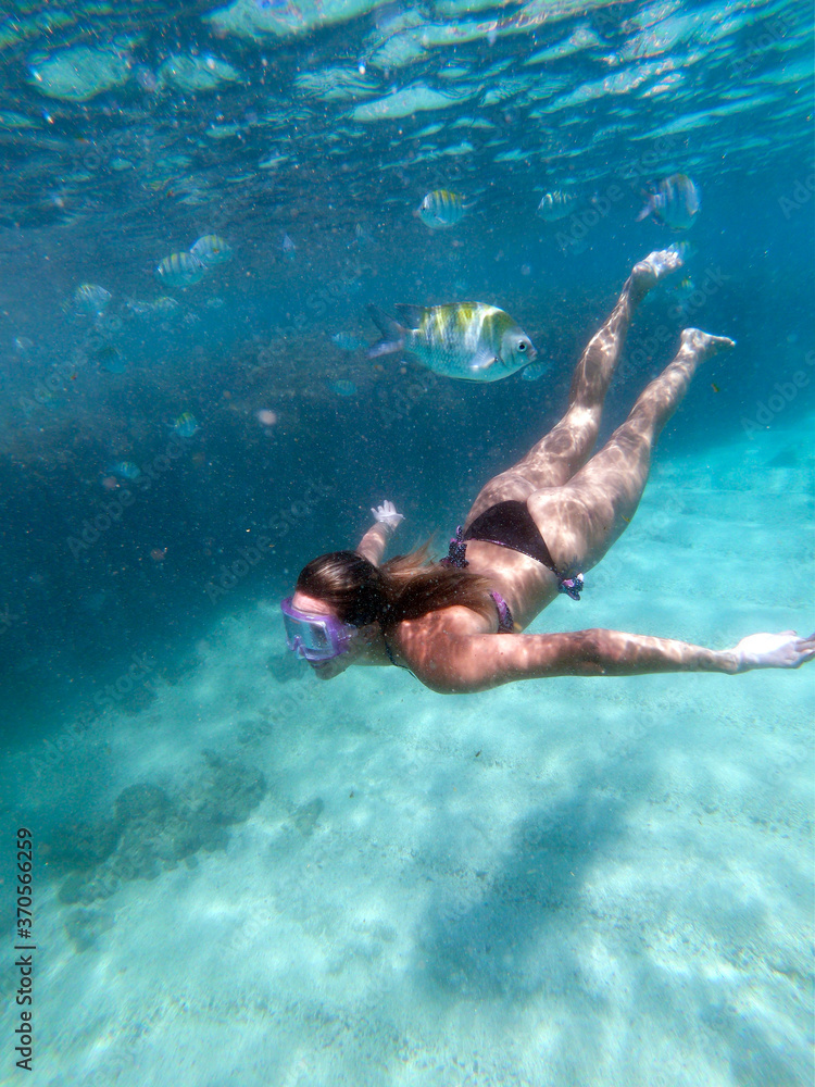 Young couple swimming in the natural pools in Porto de Galinhas Pernambuco - Brazil