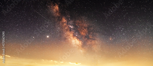 Beautiful starry sky with bright milky way galaxy. Night landscape. Astronomical background.