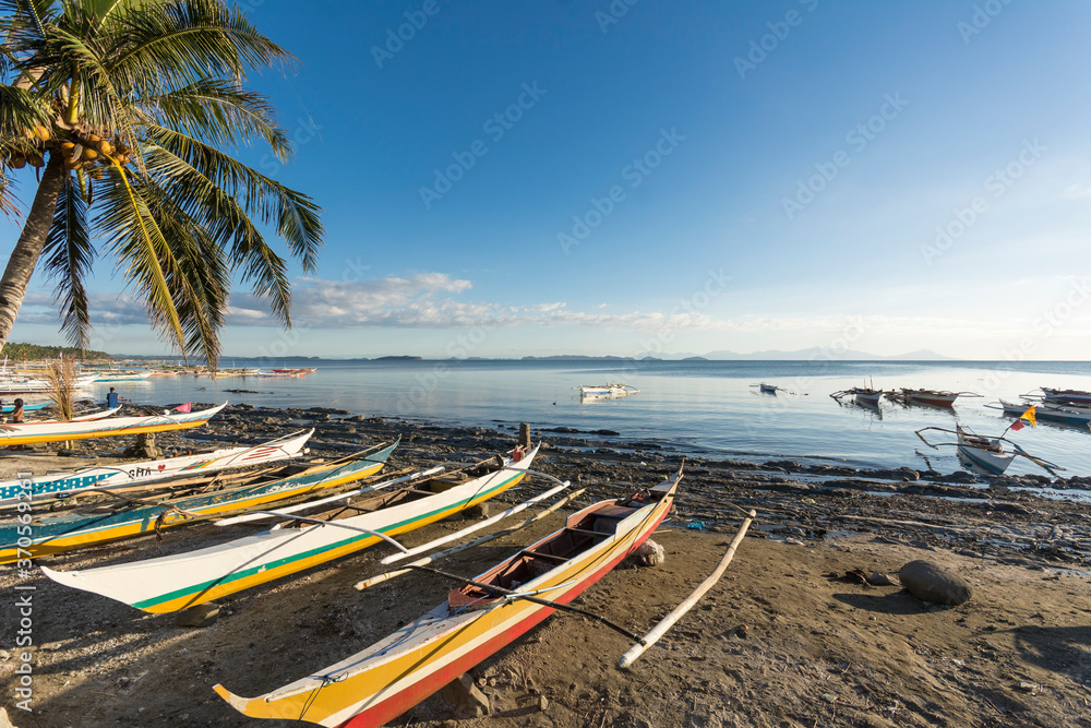 Calbayog, Samar - A line of fishing boats by the coastline. A