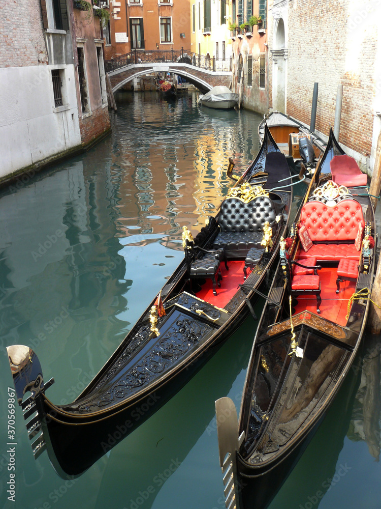 Venice (Italy). Detail of Venetian gondolas on a city canal