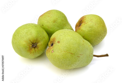 Ripening green pears arranged on white background