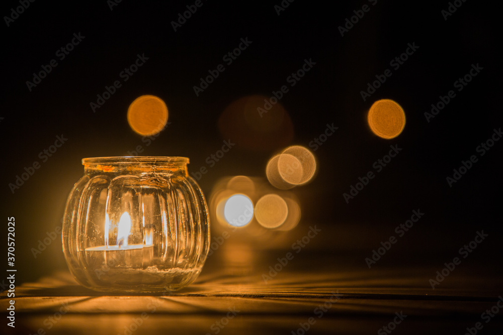 candle light in glass black background candle light in glass black background