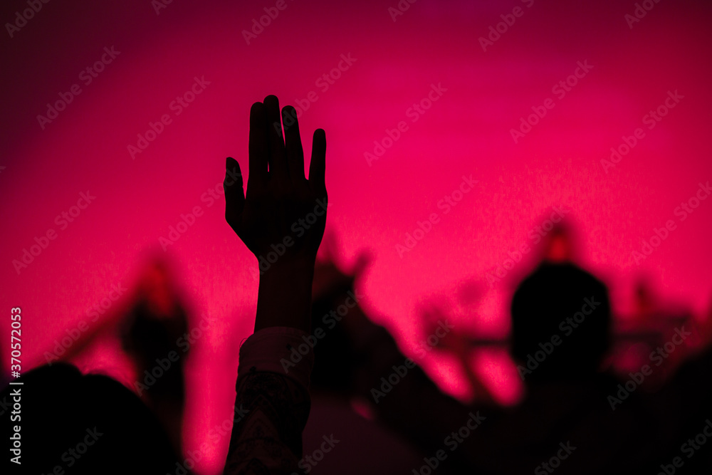 silhouette hand in church pink background