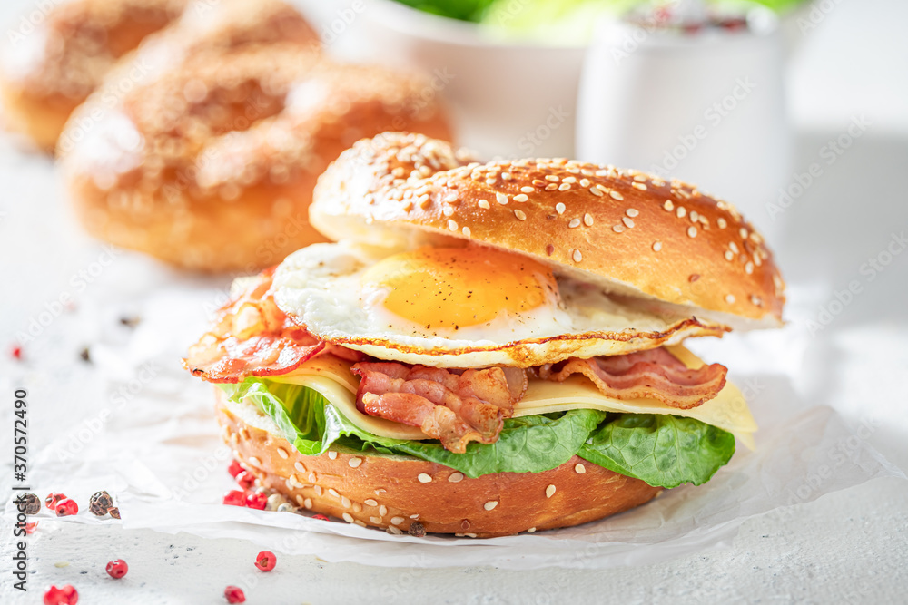 Homemade bagel with egg and bacon for breakfast Homemade bagel with egg and bacon for breakfast