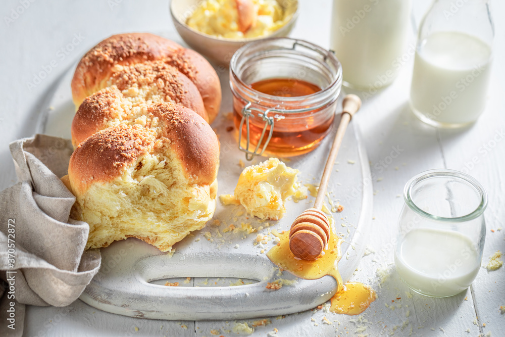Homemade challah with honey and milk in the morning Homemade challah with honey and milk in the morning